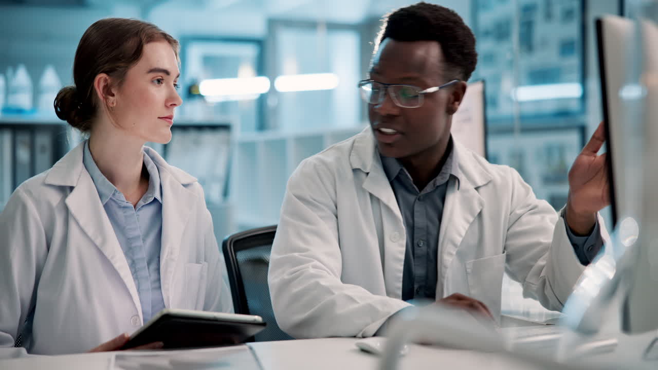 Scientists collaborating on research in a lab