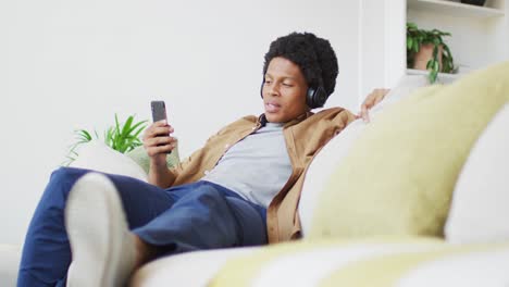 African-american-man-using-laptop-at-home