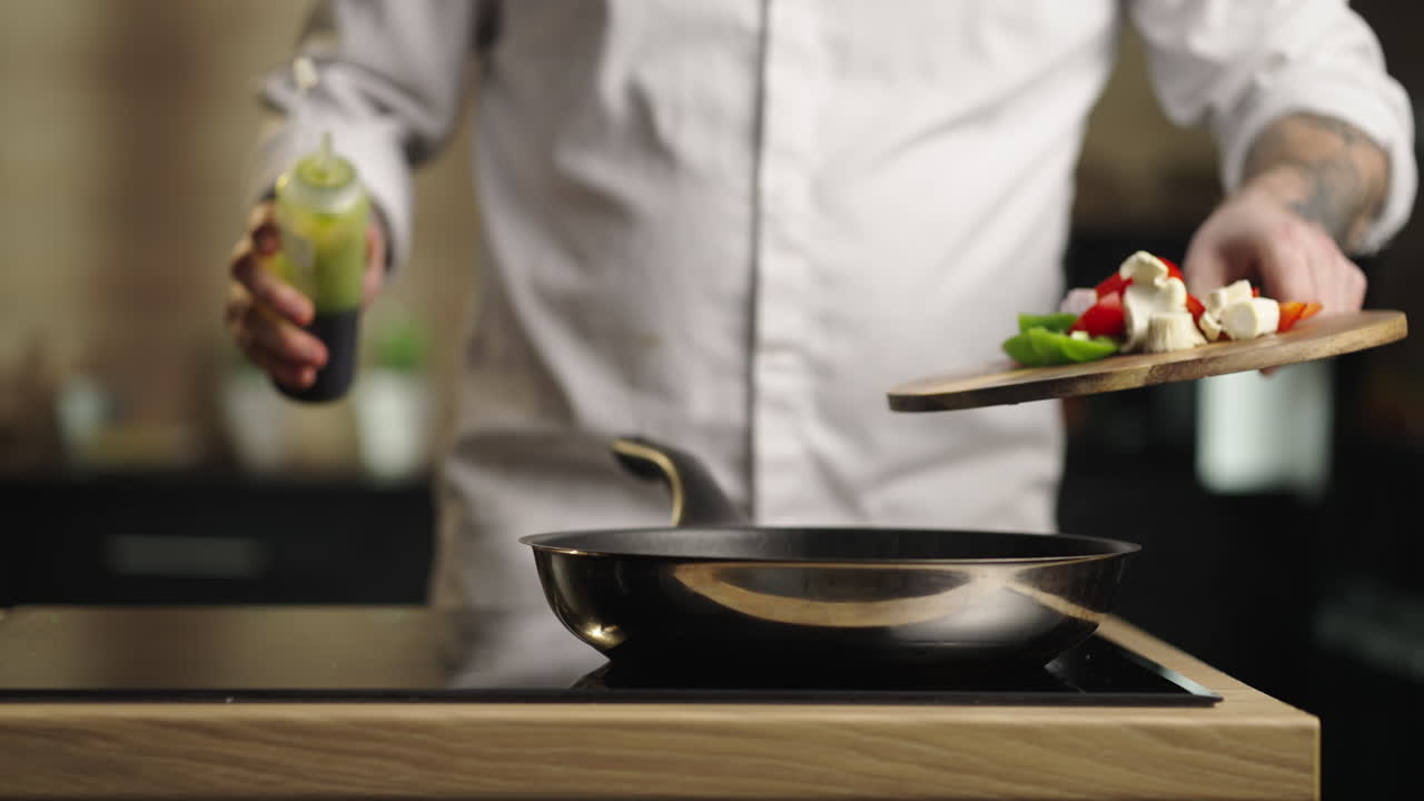 Chef preparing food in a pan