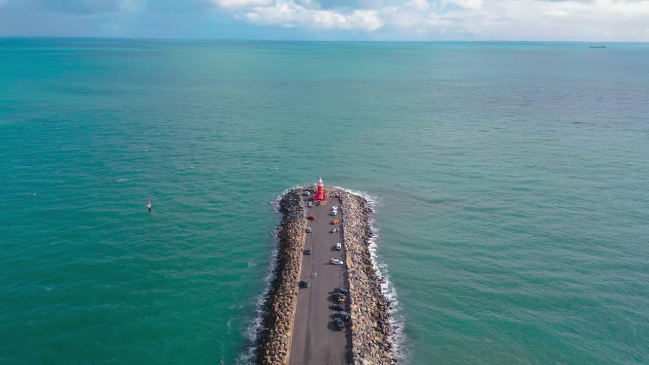 Drone footage showing an advance towards the North Mole Lighthouse in Perth, Western Australia that overlooks the vast Indian Ocean