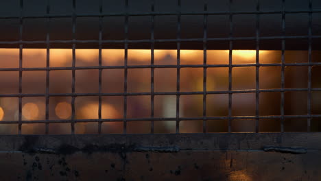 Rough-metallic-netting-mesh-in-framing-closeup.-Squared-peeling-grid-surface.