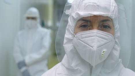 portrait of female doctor in protective uniform at work