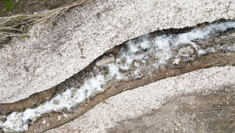 Soaring-aerial-footage-over-the-melt-water-in-the-snow-covered-Provo-canyon-in-Utah