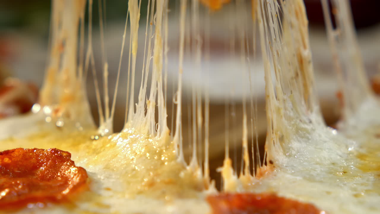 Close up of pizza with melting cheese