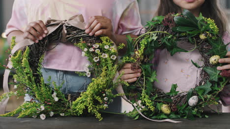 close up of children posing with flower wreaths