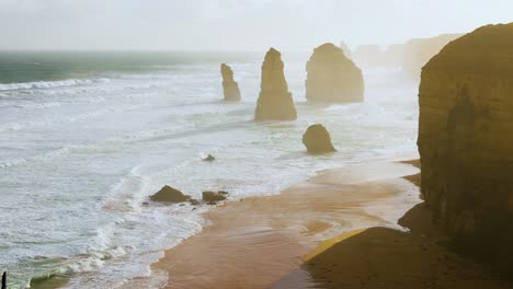 ocean waves crash against iconic limestone stacks