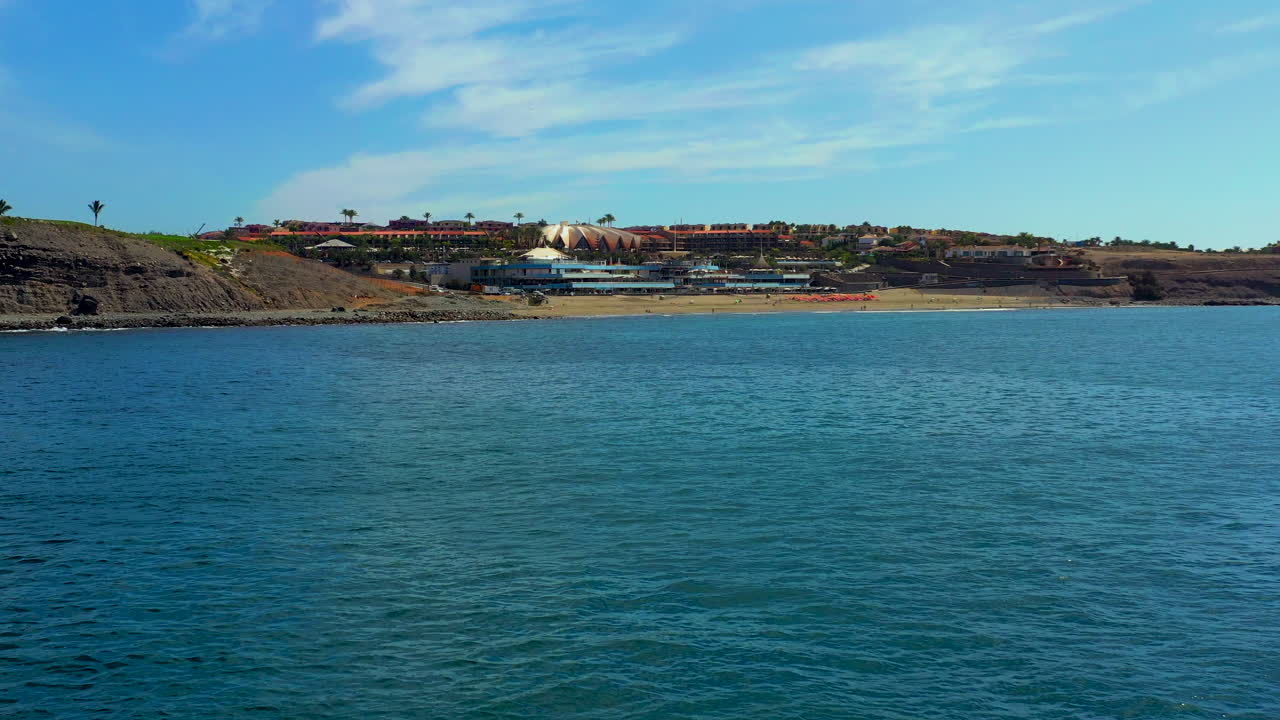 Beautiful aerial view of Gran Canaria, Maspalomas. Drone view of calm ocean, flying over sea.Aerial Maspalomas dunes view on Gran Canaria island stock footage