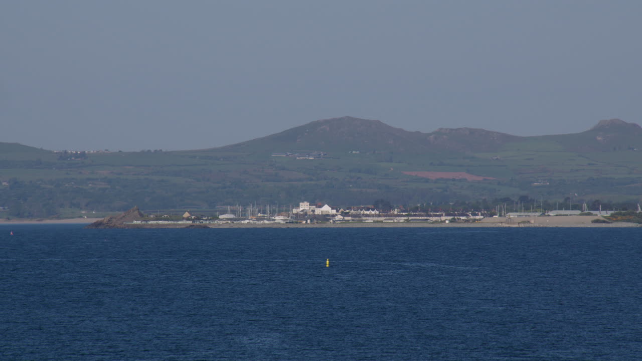 Distant shot of Pwllheli from Hafan y Môr nature reserve