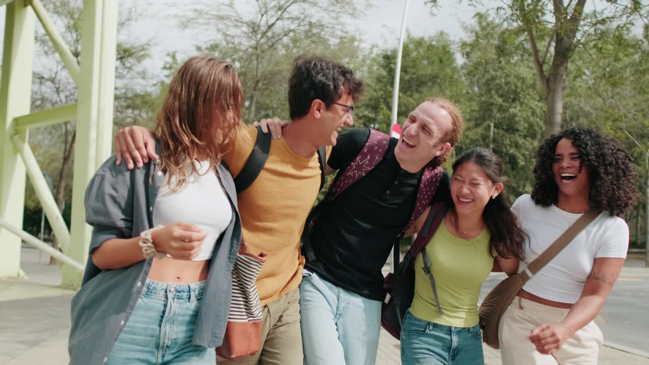 Diverse group of interracial students walking, friendship and modern college