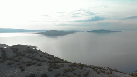 Aerial-panning-shot-of-rocky-seashore-and-islands-in-cloudy-day-3