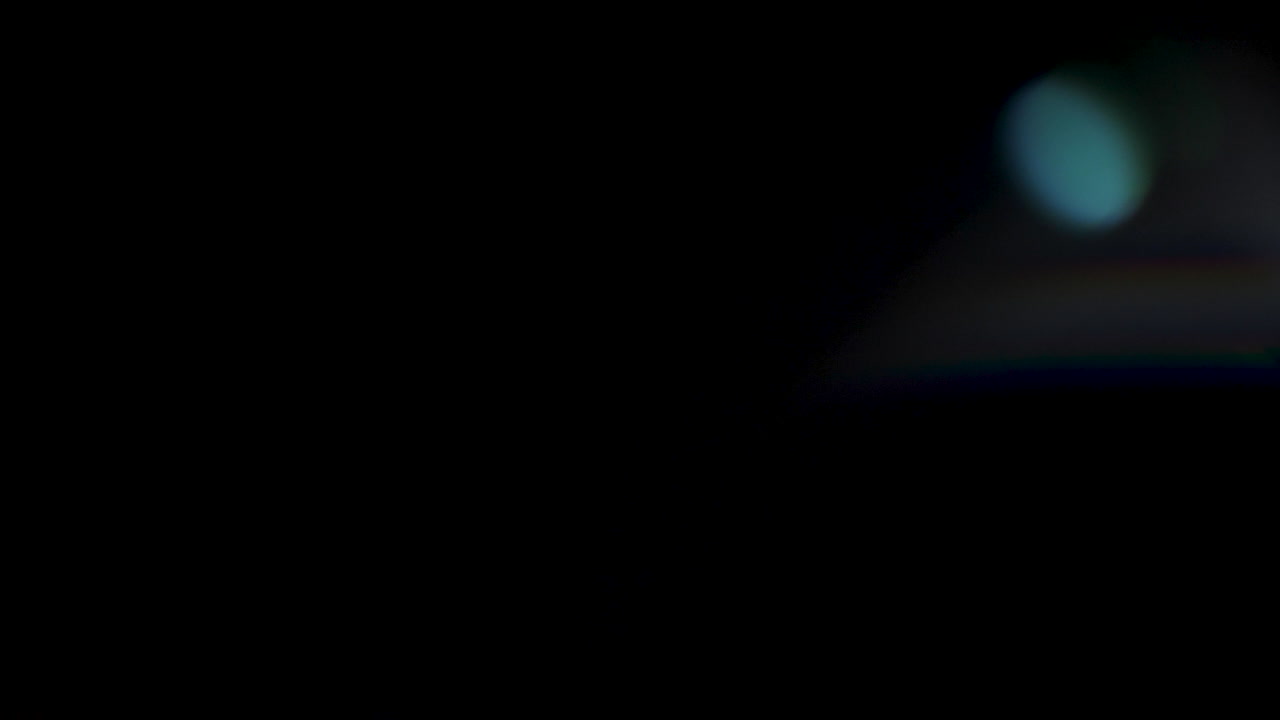 Blinking abstract light leaks on black background