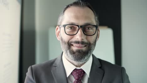 portrait of caucasian bearded middle-aged businessman