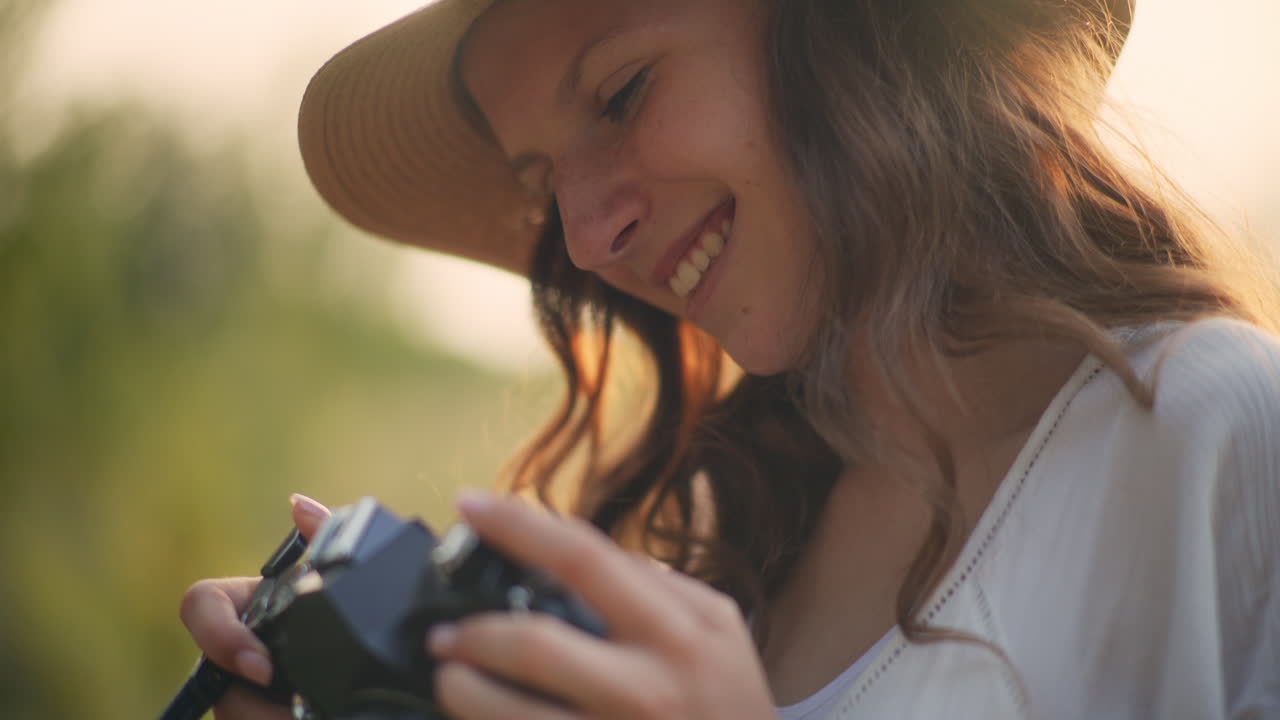 Creative girl smiling with camera outdoors