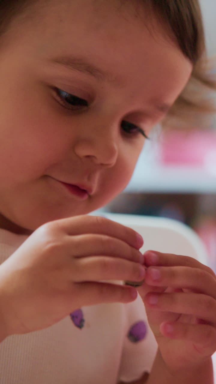 Captivating Moments of a Young Child with Expressive Features Engaged in Playful Activities, Evoking Joy and Innocence in Everyday Life