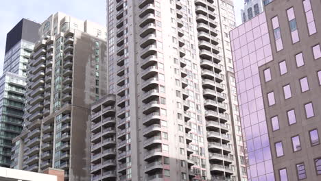 downtown buildings of non - descript city 4k day exterior