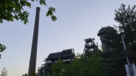 brick chimney of an old steel mill in nature