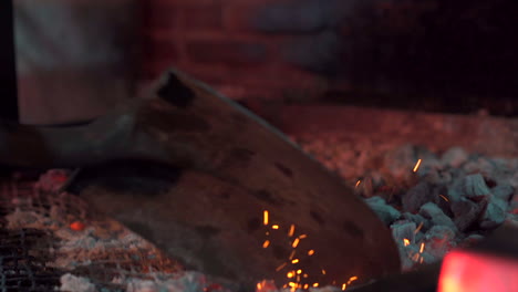 moving charcoal down the grill before cooking