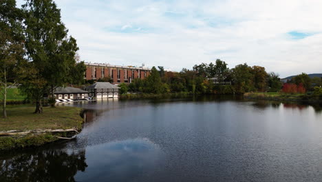 paradise pond with boathouse, the crew house and sabin-reed hall at smith college in northampton, massachusetts