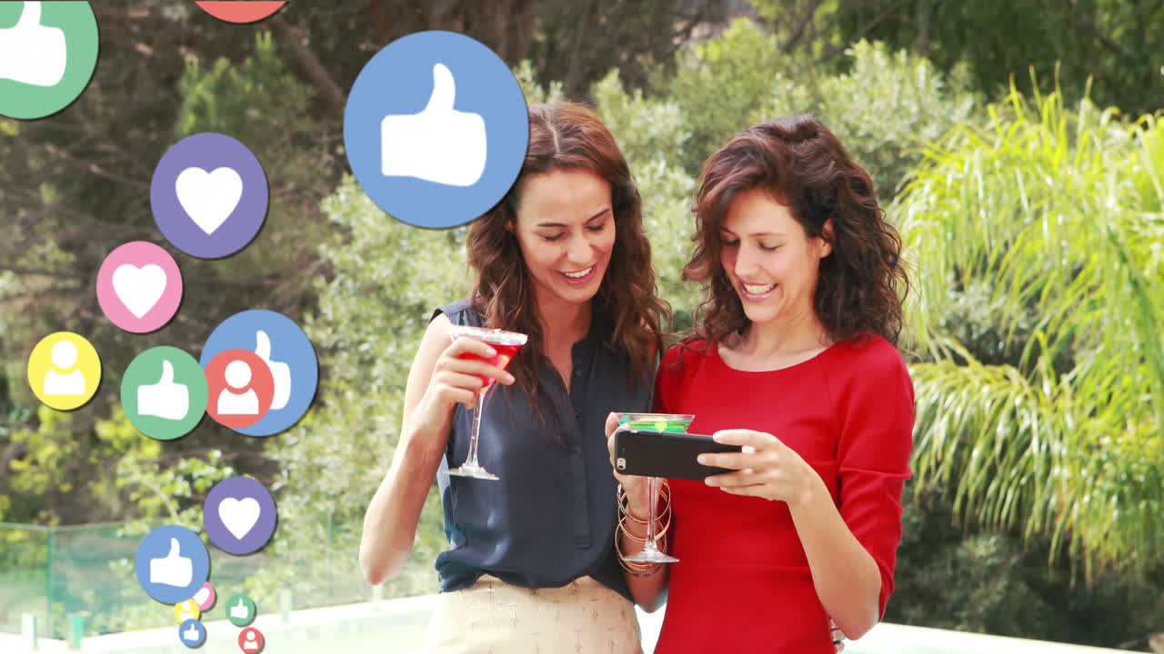 Two ladies taking selfies while drinking cocktails 4k