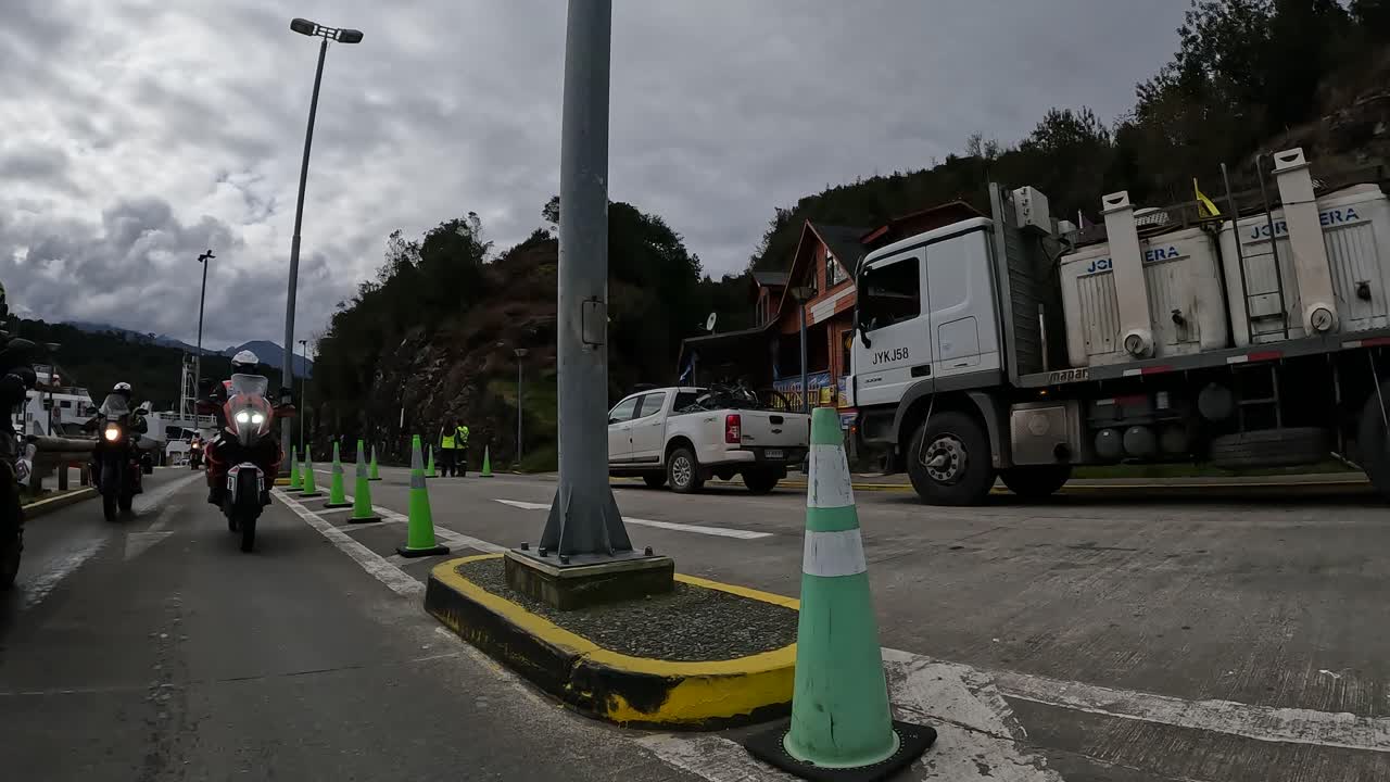 Group of ADV motorcyclists getting off a barge on the Carretera Austral, Chile