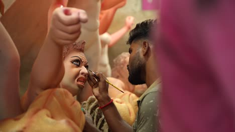 in kumortuli, idol artists are making idols of durga, the revered deity of hinduism. the work of making these idols starts from june and these potters make many idols till november.