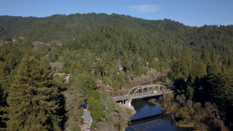 drone flying over the top of a truss bridge on the russian river in sonoma county california