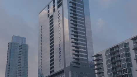 Pan-up-to-tall-building-in-Austin,-Texas