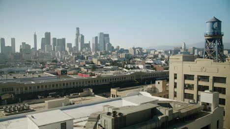 downtown los angeles cityscape with skyscrapers and industrial buildings