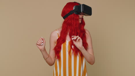 Girl-using-virtual-reality-futuristic-technology-VR-headset-helmet-to-play-simulation-3D-video-game