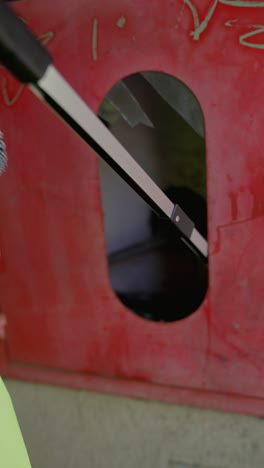 person removing trash from recycling bin