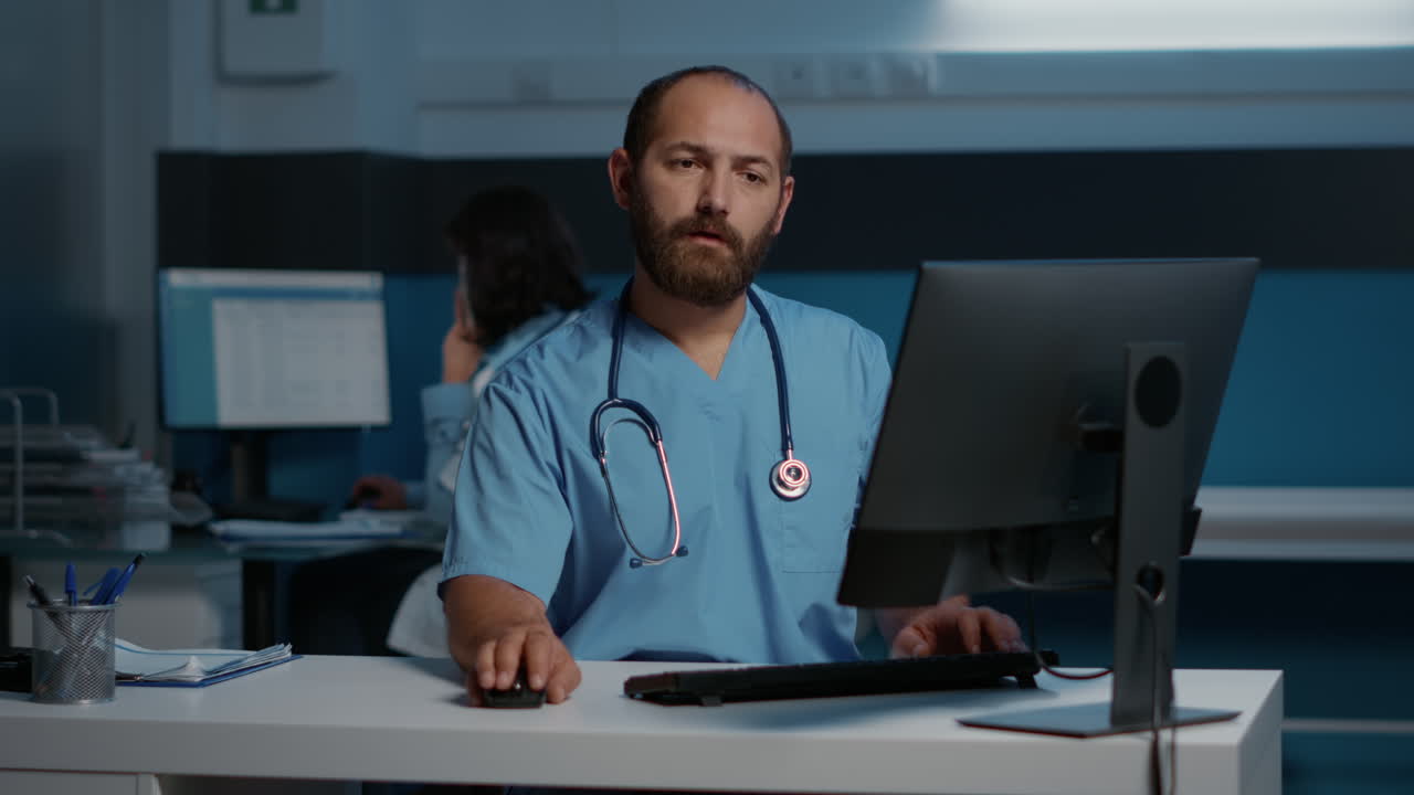 Healthcare professional working on a computer in a hospital