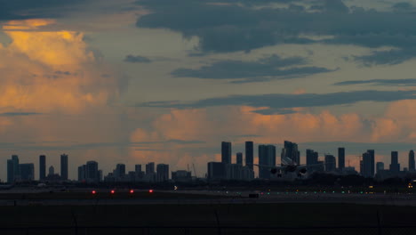 airplane landing in miami at sunset