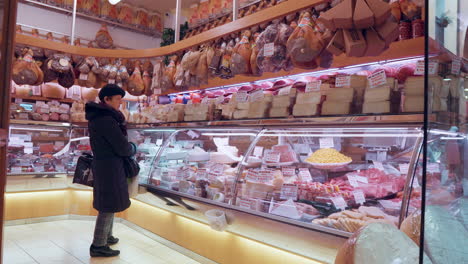 woman shopping at an italian delicatessen