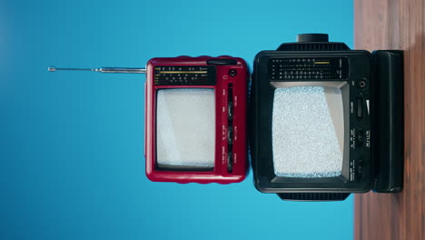 two vintage portable televisions