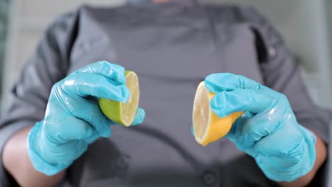 Slow motion lemon and lime being squeezed