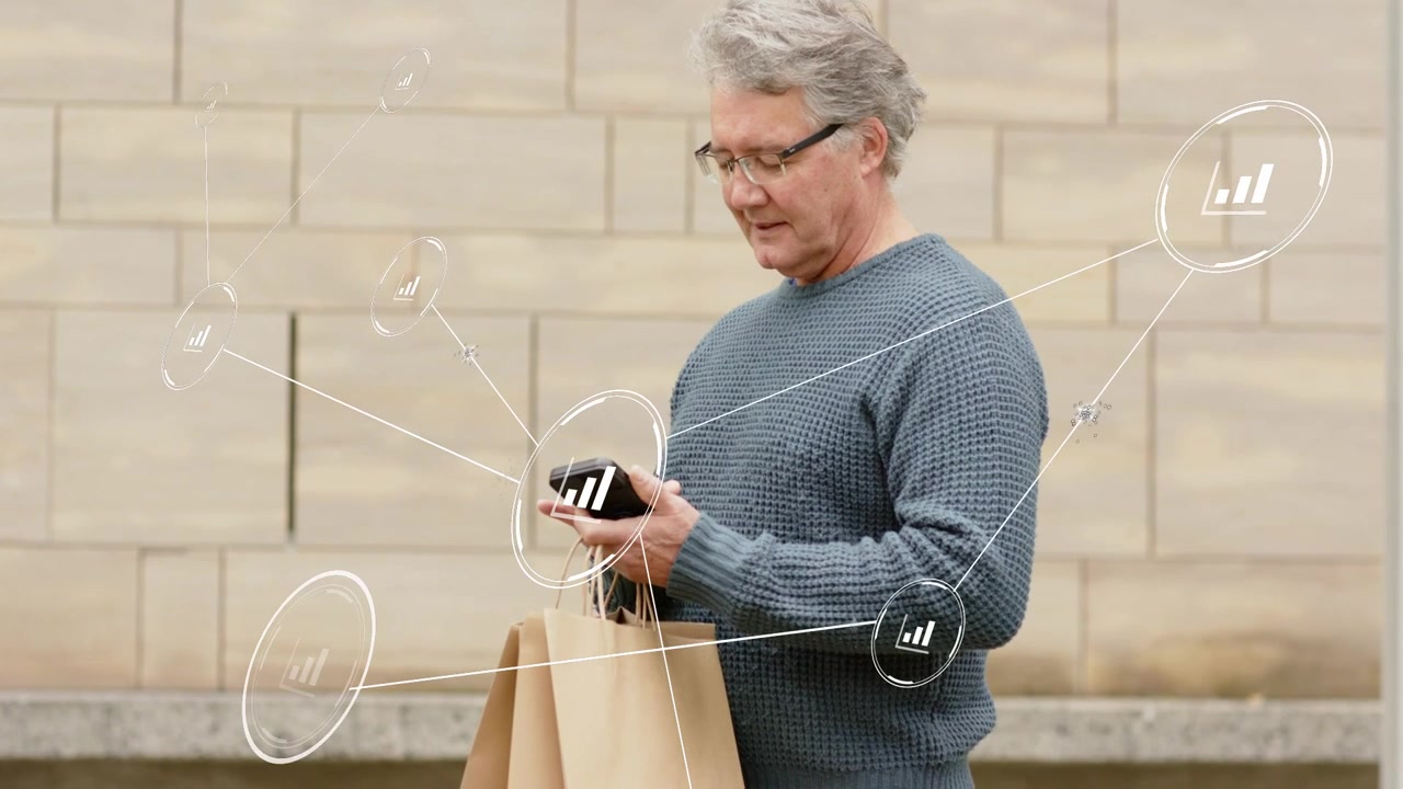 Senior man holding bags, tapping phone initiating finance network of bars tracking spend around him