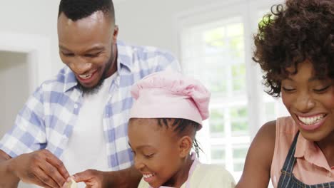 Happy-family-preparing-food-in-kitchen-