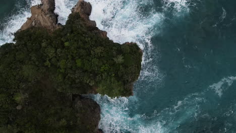 Beautiful-bird's-eye-view-of-a-steep-mountain-cliff-surrounded-by-by-the-Adriatic-sea-in-Montenegro