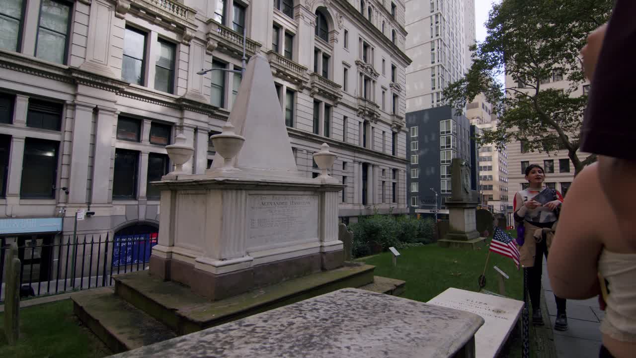 Tourists visiting the historic Trinity Church cemetery, final resting place of Alexander Hamilton