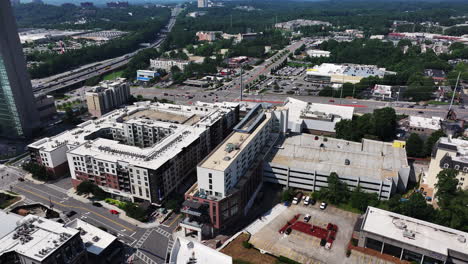 Forwards-fly-above-complex-of-buildings-in-urban-neighborhood