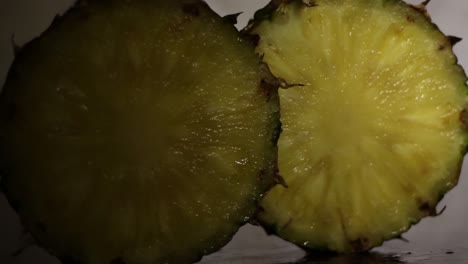 Juicy-Sweet-Comosus-Pineapple-Ananas-Slices-in-a-Dark