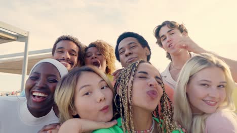 happy latin woman taking selfie with multi-ethnic friends outdoors