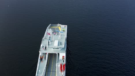 flying over electric car ferry at sea - birdseye aerial norway