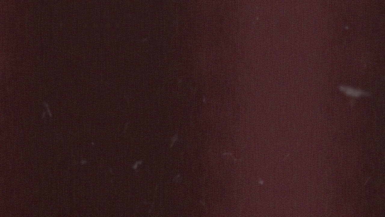 superficie roja vibrante con intrigantes manchas marrones