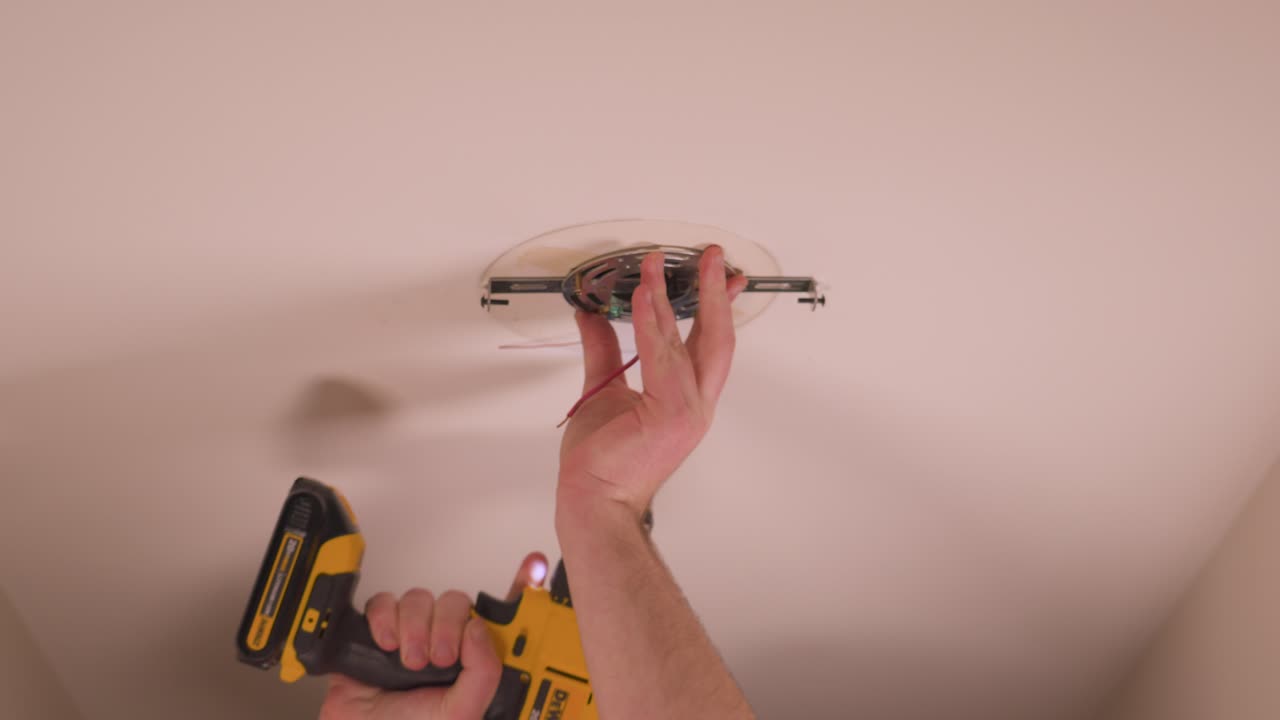 Carefully driving the screw with a drill