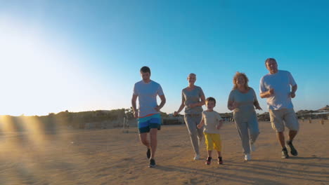 family jogging on the beach