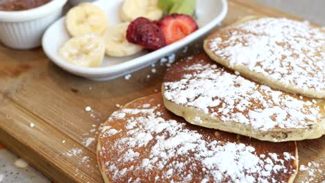 delicious pancakes with fruit and chocolate sauce