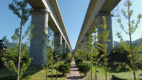 a quiet park and tall bridge