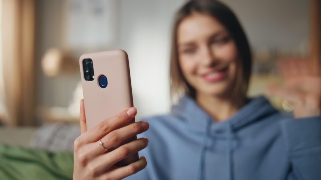 Woman taking a selfie with her phone