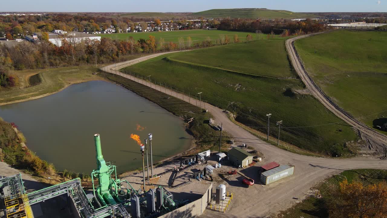 Aerial view of Biogas facility with burning off methane from a landfill in flare stack